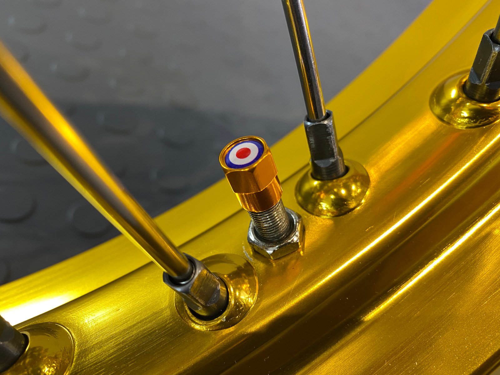 Spitfire Valve Cap On Gold Wheel